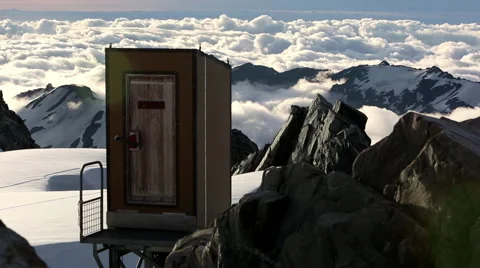 Timelapse of clouds rolling over snow covered mountains Video stock 55539185