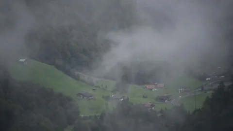 Timelapse of Clouds Rolling over Swiss Alps Valley in Interlaken Switzerland Stock Footage 80602254