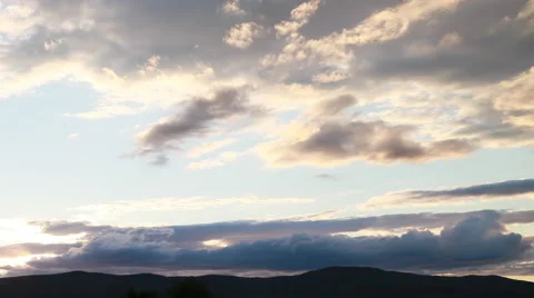 Timelapse of clouds rolling over the top of a mountain Video stock 65497786