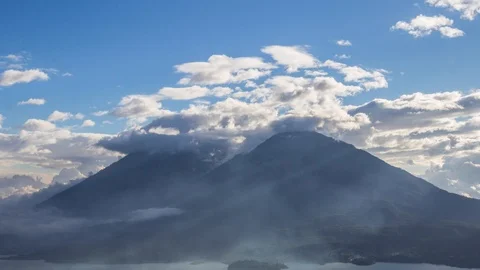 Timelapse of clouds rolling over volcanoes Toliman and Atitlan Stock Footage 108454064