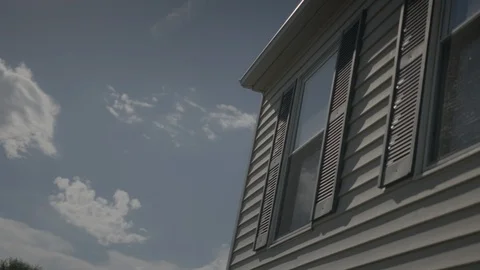 Timelapse of Clouds Rolling past a Residential Home HD Video Video stock 91256574