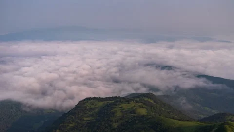 Timelapse - Clouds rolling in a valley 4K30 Stock Footage 270358852