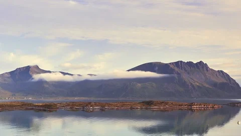 Timelapse, clouds run across the sky, through the mountains and Stock Footage 122719836