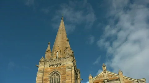 Timelapse of clouds running above anglican church spire Video stock 500057