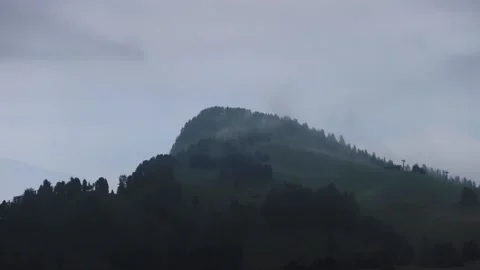 Timelapse of clouds running over a hill in the dolomites Stock Footage 211331915