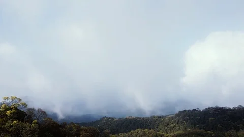 Timelapse of clouds shadow over mountain forest Stock Footage 74820332