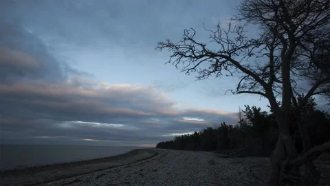 TImelapse of clouds skimming over a bare coast Video stock 168306479
