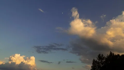 Timelapse of Clouds, Sky, and Moon During Sunset Stock Footage 112132558