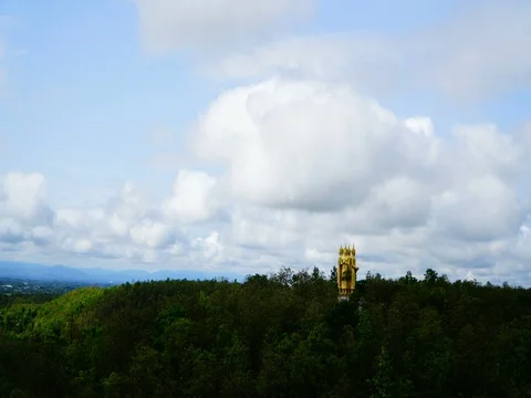Timelapse Clouds on the sky with buddha statue on hill Video stock 75954558