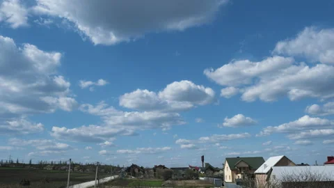 Timelapse of the clouds in the sky in the willage Stock Footage