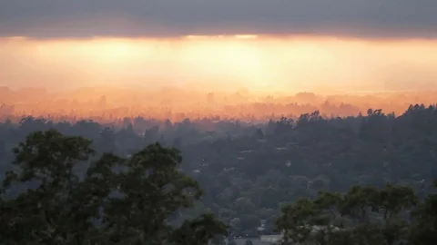Timelapse Clouds, Sun Rays, Sunset over Mountain City Stock Footage 71123430