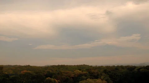 Timelapse clouds at sunset over jungle near Caracol, Belize, Central America Vídeo Stock 31117470