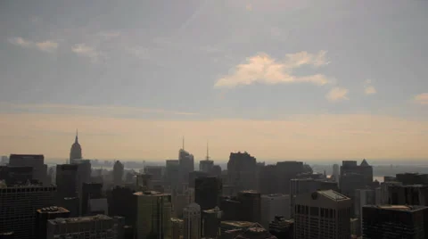Timelapse clouds at sunset over midtown manhattan, new york Stock Footage 31186565