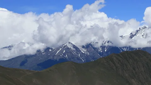 Timelapse Clouds swirl over a green mountain valley. Mustang, Nepal, Annapurna Stock Footage 155264732