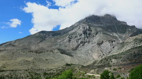 Timelapse Clouds swirl over a green mountain valley. Mustang, Nepal, Annapurna Stock Footage 155264958