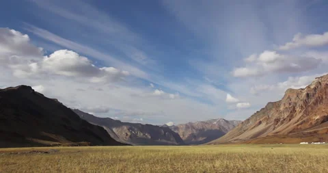 Timelapse Clouds swirl over a green mountain valley. Mustang, Nepal, Annapurna Stock Footage 155674617