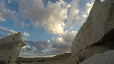 Timelapse of clouds through rocks Stock Footage 311089163