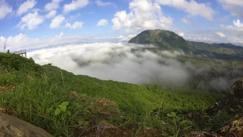 Timelapse of clouds under the foot of the hill Stock Footage 169761350