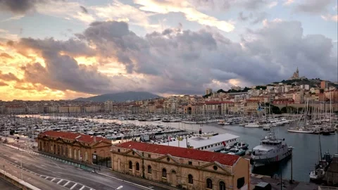 Timelapse of cloudscape over Old Port of Marseille and Notre Dame de la Garde Stock Footage 169410668