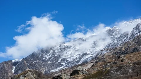 Timelapse of cloudscape over snowy mountain in Langtang Valley, Nepal Stock Footage 89211299