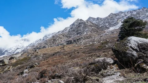 Timelapse of cloudscape over snowy mountain Stock Footage 89213623