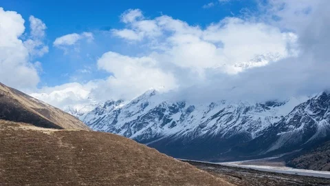 Timelapse of cloudscape over snowy mountain in Langtang Valley, Nepal Stock Footage 90237298