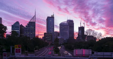 Timelapse of a cloudy and colourful sunset over Sydney traffic, Australia Stock Footage