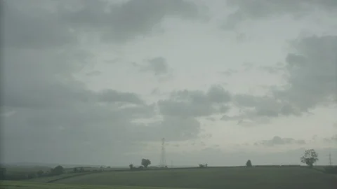 TIMELAPSE CLOUDY COUNTRYSIDE FIELD Stock Footage 86655754