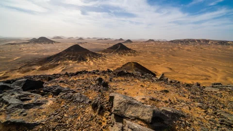 Timelapse of a cloudy day in the Black Desert, Egypt. Video stock 245804411