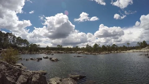 Timelapse - Cloudy day at the forest next to the lake Video stock 83879484
