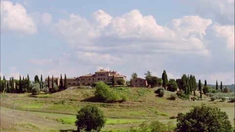 Timelapse in a cloudy day of landscape of countryside, farmland in Tuscany Stock Footage 138325904