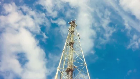 TimeLapse of a cloudy daytime sky with a GSM base station, loop video Stock Footage 76551846