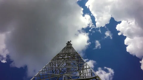 TimeLapse of a cloudy daytime sky with a GSM base station, loop video Stock Footage 76552631