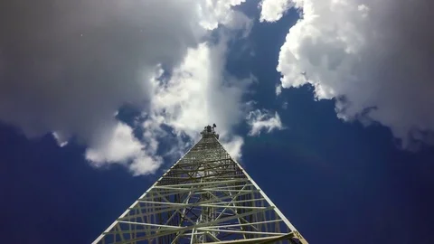TimeLapse of a cloudy daytime sky with a GSM base station, loop video Stock Footage 76720510