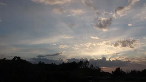 Timelapse of cloudy sky in the countryside at sunset Stock Footage 155140201