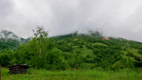 Timelapse of the cloudy sky in the mountains. The clouds are floating fast Stock Footage 134539504