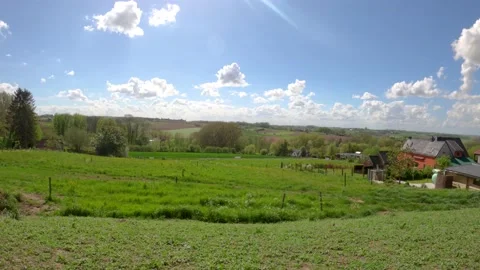 Timelapse of a cloudy sky over a landscape in the flemish ardennes Stock-Footage 153978102