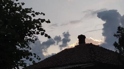 Timelapse of cloudy sky over the old roof Stock Footage 197257985