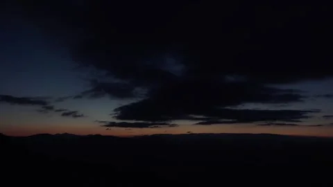 Timelapse of cloudy sky before sunrise at end of night - Orange and Scenic Sky Stock Footage 339374831