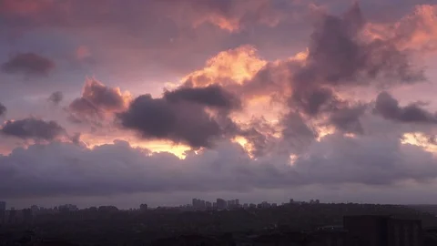Timelapse cloudy sky at sunset over city Stock Footage 97908821