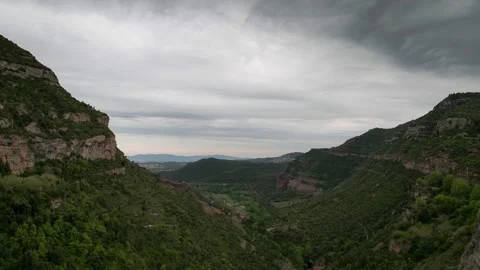 Timelapse of cloudy storm day in Sant Miquel de Fai, Barcelona, Catalunya, Stock Footage 269281626