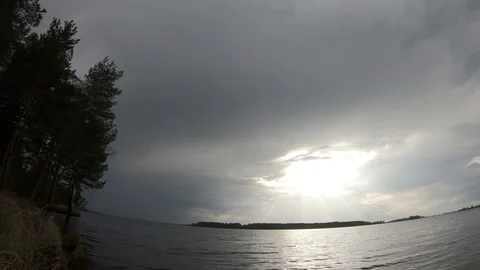 Timelapse cloudy weather on the lake. Timelapse the approach of the storm. Stock Footage 107626680