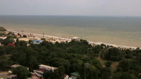 A timelapse of a coastal town on a cloudy day from above Stock Footage 337426409
