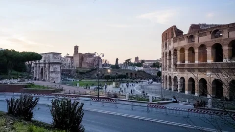 Timelapse of the Coliseum and the Arch of Constantine during sunset, Rome Stock Footage 125925944