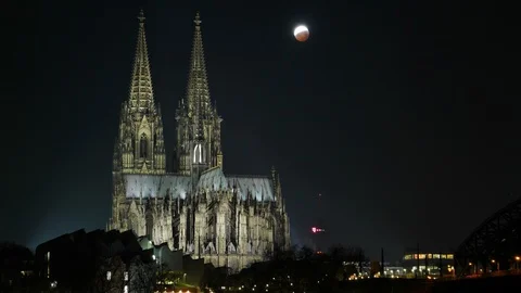 Timelapse of Cologne Cathedral with moon during lunar eclipse 2019 Stock Footage 101611561