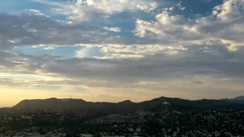 Timelapse of Colorful Sunset Clouds Over West Los Angeles Hillside Homes Vídeos de archivo 240237898