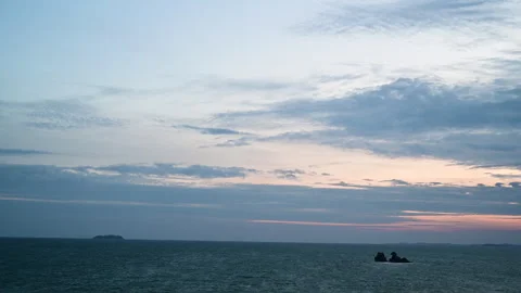 Timelapse of the colorful sunset view at the beach with ocean waves and clouds. Stock Footage 248944410