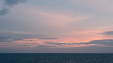 Timelapse of the colorful sunset view at the beach with ocean waves and clouds. Stock Footage 248944411