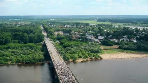 A timelapse of a column of orthodox pilgrims moving on the bridge Stock Footage 73816939