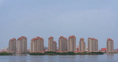 Timelapse, Common Apartment Building at Seaside with Blue Sky Background Stock Footage 88711915